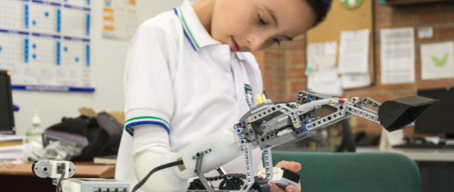 a child using a lego prosthetic hand