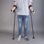 a person using two KMINA crutches