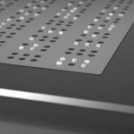 Image showing a close up of the top screen of Blitab. It shows the smart fluid filling the right air channels on the top screen to display the right letters in braille.