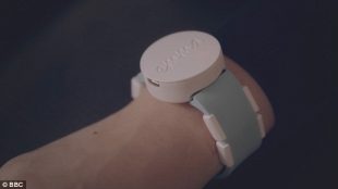 photo of the wearable that reduces Emma's hand tremors because of her parkinson's. This wearable, that looks like a watch and is worn like that too, is called "The Emma".