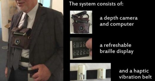 a blind person is seen wearing the 3d camera around his neck, and wearing the belt with haptic feedback as well as the refreshable braille display