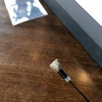The touchfunction is made of soft silver fibers that gently hits the touch screen yet registers a touch. Here it is seen in its extended form when a user puffs from the other side.