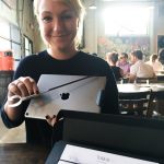 Lizanne Svane, partner at Tubus Technology , is seen holding a TubusOne in her right hand. In her left hand, she is holding an iPad.