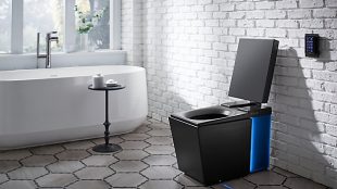 Photo of kohler’s numi intelligent toilet in a bathroom.