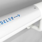 "Toilet" signage in Braille Neue