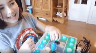 Ava, Rory's daughter, seen here playing Zelda with the new adaptive controller her dad built for her.