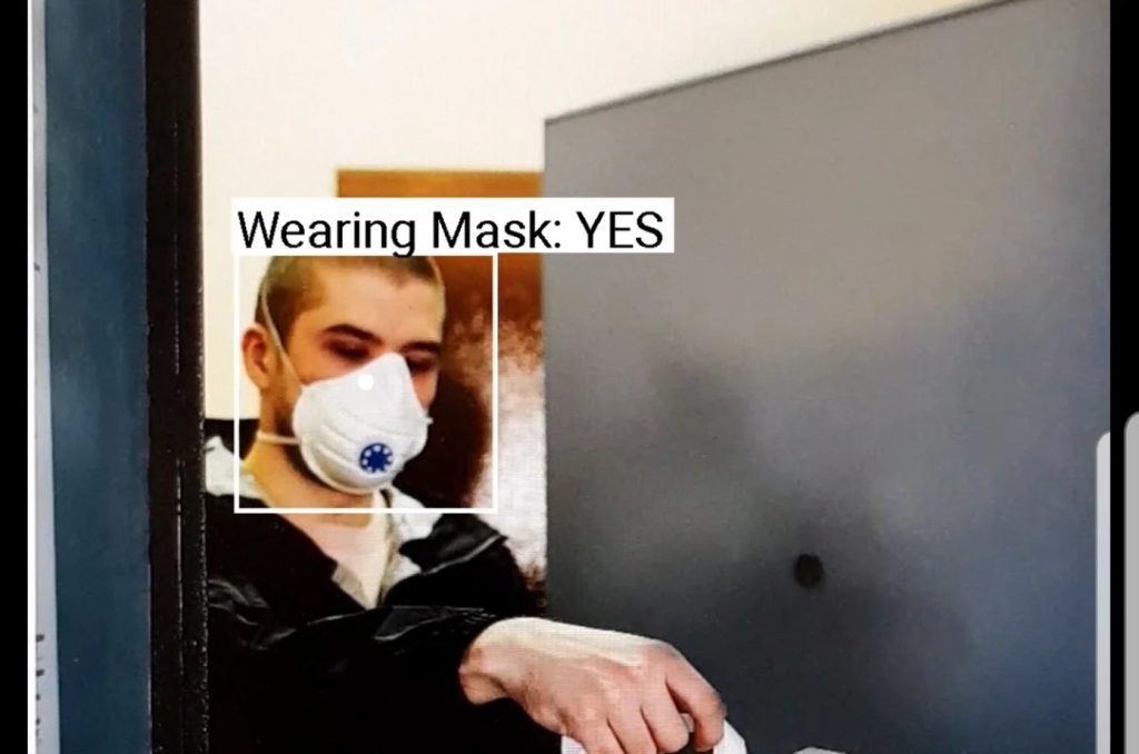 audible vision app detecting a mask on a man. It displays label "wearing mask: yes"