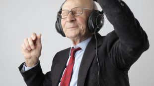 man in black jacket wearing black headphones