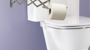 image of extend-a-roll installed in a bathroom with its arm extended out.