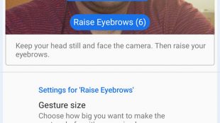 A person setting up their android phone for facial gestures. Screen shows camera enabled with a blue box around his face with raised eyebrows with label “raise eyebrows”. There are some settings options in the bottom half.