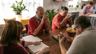 Five players featured in the documentary seen sitting around a dining table playing fantasy football