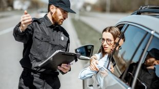 police officer seen talking to a car driver