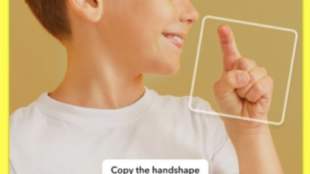 a young boy copying handshapes from the asl alphabet lens on snapchat