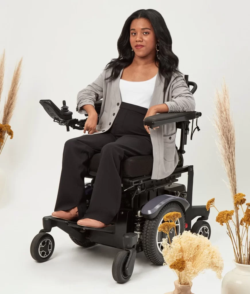 a woman in a wheelchair wearing the "Nina cardigan" in gray by magnaready