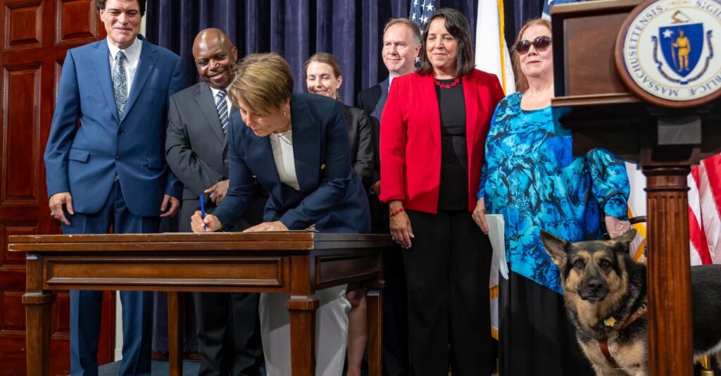 Gov. Maura Healey (center left), Lt. Gov. Kim Driscoll (center right), Secretary of Technology Services and Security Jason Snyder (center rear) and representatives of the disability community gather on the 33rd anniversary of the signing of the Americans with Disabilities Act (ADA) to sign Executive Order No. 614, creating the Digital Accessibility and Equity Governance Board to strengthen and advance digital accessibility and equity within the state, at the Statehouse on July 26, 2023.