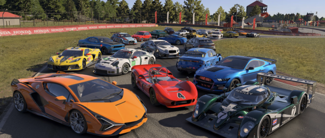 A group of racing cars lined up on a racetrack. The cars are all different colors and styles, including a red Ferrari, a blue Porsche, a yellow Lamborghini, a green Aston Martin, and a black McLaren. The cars are all parked in a row on the track, with their engines running and their drivers ready to race. The image is taken from a high vantage point, and the racetrack is surrounded by trees and hills. The sky is blue and clear, and the sun is shining brightly. The image is from the Forza Motorsport website, and it is being used to promote the upcoming release of the game. The game is a racing simulator, and it allows players to race a variety of different cars on different tracks. The image is meant to give viewers a glimpse of the different cars that will be available in the game, and it also shows the beautiful graphics that the game will feature.