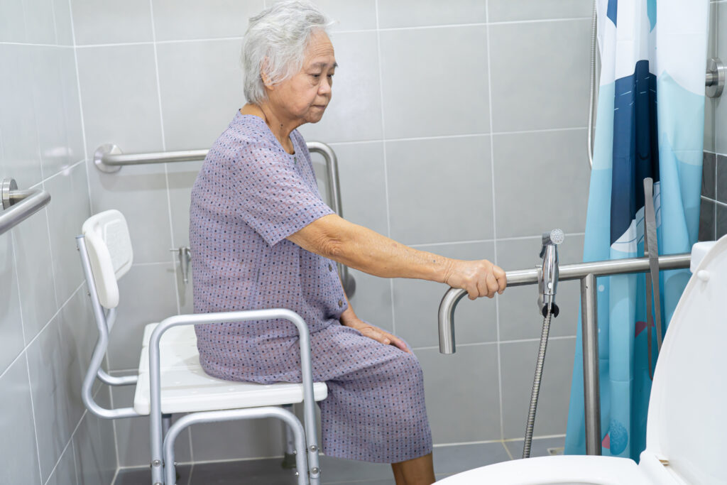 Asian senior or elderly old lady woman patient use toilet bathroom handle security in nursing hospital ward, healthy strong medical concept.