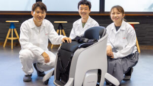 Honda employees posing with the UNI-ONE.