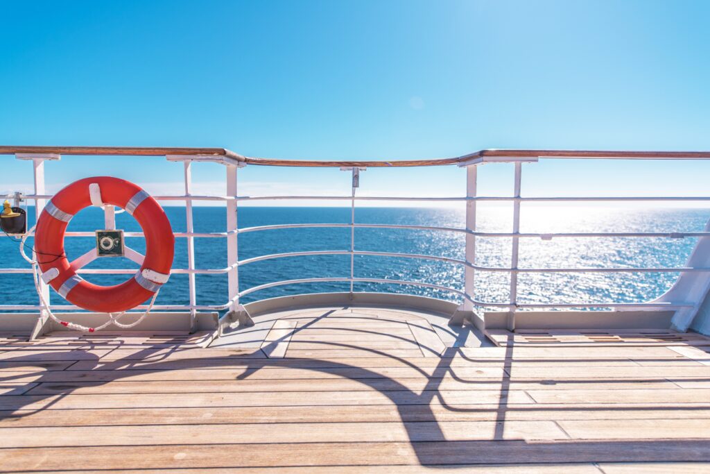 Cruise Ship Wooden Deck and Lifebuoy Ling. Ocean Liner Theme.