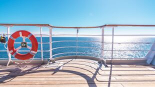 Cruise Ship Wooden Deck and Lifebuoy Ling. Ocean Liner Theme.