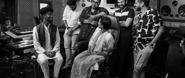 Team picture in Shankar’s studio. From the left, standing: sound engineer Ameya Mategaonkar; Shankar; producer Soumil Shringarpure; lyricist Tanishk Nabar. From the left, seated: Googlers Arathi Sethumadhavan and Aaron Wade.