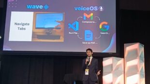Young entrepreneur Dhanvin Ganeshkumar, dressed in a suit, presents on a stage at SXSW EDU. Behind him, a presentation slide for his solution, "Swype," shows its two components: "wave" for gesture control to navigate tabs and "voiceOS" for voice commands to perform tasks like searching Google or saving files.