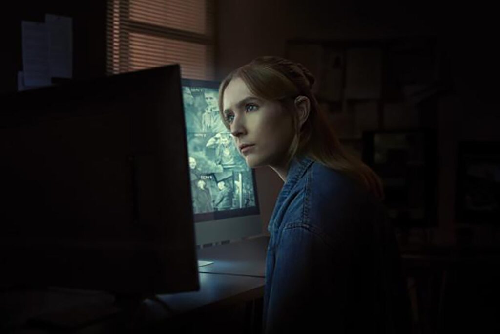 Rose Ayling-Ellis, with a concerned expression, is seen staring at a computer monitor.